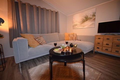 This detached chalet is located in a holiday park on the Wadden Sea, which makes this accommodation very suitable to use as a base to discover North Holland. The chalet is furnished in a modern and attractive way, with a luxurious corner sofa and a c...