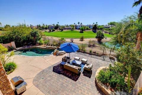Guard Gateed Community in Red Rock Country Club. Close to airport, shopping, restrauunts, and freeways. With modern touches throughout, this home is like no other. European style cabinetry, quartzite counter with spectacular waterfall edge extending ...