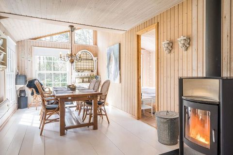 MAX 1 dog. Really cozy cottage, located in the middle of Ho among old trees and birdsong. The cottage is kept in bright colors and oozes soul, summer and water. Kitchen and living room are in open connection and with the wood stove, as a good centerp...