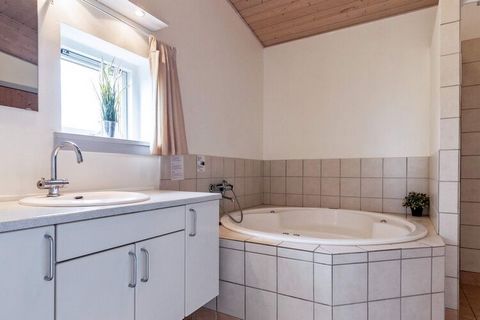 Well-maintained holiday cottage on a natural plot with a fantastic view of the ocean and the hilly nature area near Faaborg. Emphasis is placed on the house to appear bright with large picture windows that lead out to the partially covered/open terra...