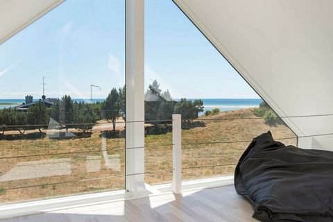 With views of the surrounding areas and the sea at Øer Strand which can be enjoyed from the 1st floor, a holiday in this modern cottage can be an unforgettable experience. The house was built in 2014 and has an incredibly beautiful light due to the l...