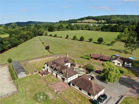 This small 'Surrey Hills' estate which has never been on the market before, standing in 13 acres, offers a wonderful combination of rural charm, outstanding natural beauty, and convenient access to transportation links. A well presented 5 bedroom det...