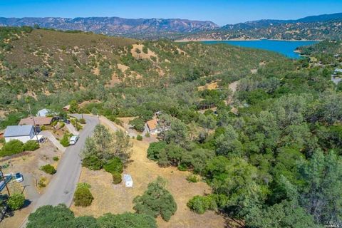Captivating Lake Views! Just a stone's throw from the Spanish Flat Recreation Area, nestled in the enchanting Spanish Flat Woodlands. Take advantage of this fantastic opportunity - Plus, the water connection fees have already been settled by the sell...