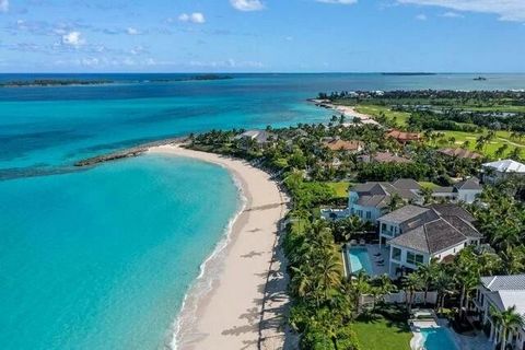GADAIT International presents this one-of-a-kind residence nestled on a beachfront estate on Paradise Island. With its contemporary design and clean lines, this home stands out like no other in Ocean Club Estates. The main house spans 4 levels, offer...