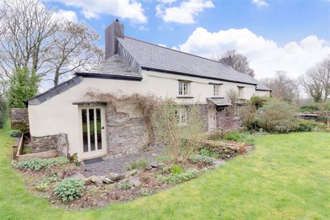 Impeccably positioned in a picturesque semi-rural setting, this stunning Grade II Listed detached three bedroom character cottage, with climbers growing along the front elevation, offers a perfect blend of privacy and tranquillity.     The property e...