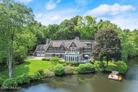 Lakeside living at its finest with 400' frontage on 11-acre Frye Lake. Designed and built by noted architect and builder, this Adirondack style home boasts nearly 8,000 sq. ft. of open light-filled spaces with water views from every room. Superior cr...