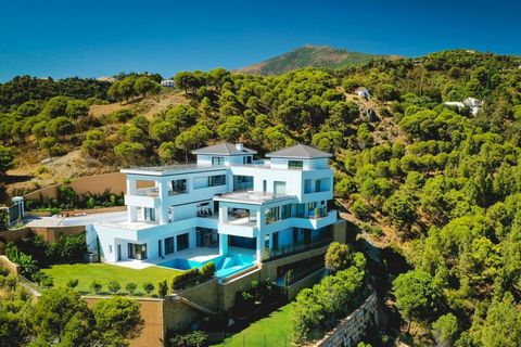 VILLA THALASSA URB. AL CUZ CUZ, BENAHAVÍS This unique, newly built, state-of-the-art villa is located on a hilltop in the Alcuzcuz Natural Reserve, a 15-minute drive from Puerto Banús. The villa has stunning views of the sea, mountains, golf, and for...