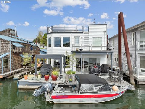 Fantastic floating home, gleaming hardwood floors on both levels, kitchen has newer refrigerator, dishwasher & microwave past two years. Two bedrooms, two bathrooms with upper primary suite including sitting room, newer bathroom has 2 sinks + large w...