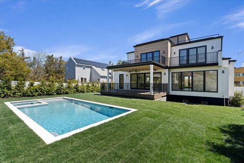 Nestled within Southampton's heart, this residence blends timeless sophistication with modern contemporary allure. Lush landscaping beckons, hinting at opulence within. Inside, natural light dances off walls, creating an atmosphere of warmth. The ope...