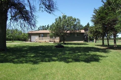 Are you looking for a country oasis, look no further than this 3 bedroom, 1 bath home that is located just 30 minutes from Wichita between Udall and Winfield nestled on 9.81 acres. This home has a ton of potential with its beautiful views and 4 outbu...