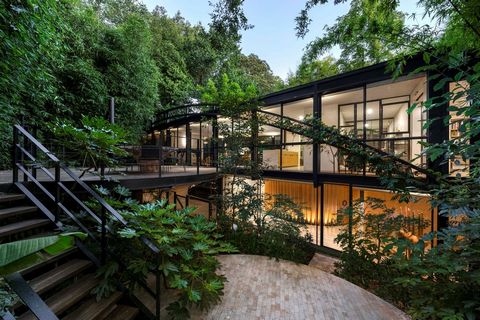 A brilliant collaboration 60 years apart by celebrated architects Robin Boyd and Stephen Jolson has resulted in a unique and utterly breathtaking family sanctuary nestled within a secluded 1373sqm approx. “rainforest” at the end of one of Toorak’s mo...