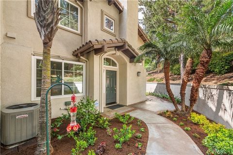Situated on a premium corner lot with backyard; a rarity in the Tierra Montanosa tract this highly desirable floorplan has vaulted ceilings and abundant windows to allow natural light. Downstairs features tile flooring, full bath and large bedroom wi...