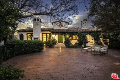 Indulge in the epitome of Spanish elegance with this remarkable residence nestled in the coveted Outpost Estates. Beyond its private gate, adorned with vibrant bougainvillea, lies a courtyard full of true Spanish charm, offering the perfect setting f...