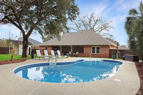 Welcome to this stunning 4-bedroom, 2-bathroom pool home in the highly sought-after Hammersmith subdivision in Pace, FL. With over 2,200 sq. ft. of beautifully designed living space, this home offers the perfect blend of elegance, modern upgrades, an...