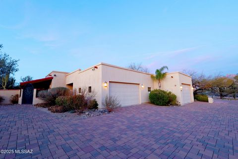 Custom 2008 modern southwestern style estate set on a sprawling 2.7acre lot, surrounded by 23 majestic saguaros & unobstructed Pusch Ridge mountain views. This iconic property is known by locals as the wagon wheel wall house. Say YES to a professiona...