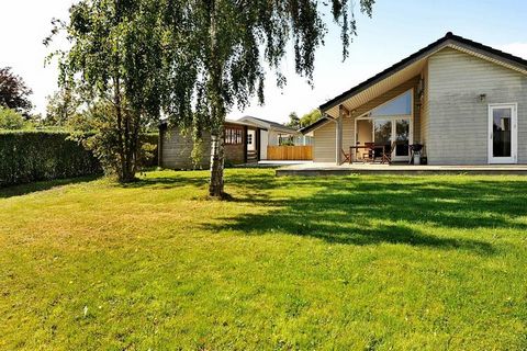 A well-arranged holiday cottage with a whirlpool and sauna, located on a large plot with a fine lawn where children can rump around. The house is bright with a pitched roof and equipped with a nice kitchen and many facilities that will improve your h...