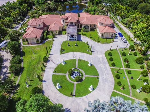 Welcome! This MAGNIFICENT LUXURY MEDITERRANEAN ESTATE boasts 13,656 total sq/ft ~ (10,192 ua). A true oasis of luxury nestled on just over 5 acres of meticulously manicured grounds. With its sprawling 10,000+ square feet of living space and nine lavi...