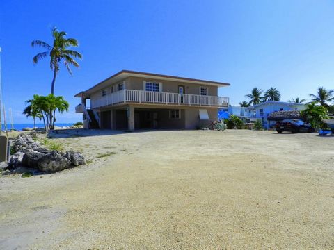 Have it your way! Oceanfront Concrete Construction Home on 3 lots with 300 Linear feet of waterfront, direct ocean access, dock and private boat ramp, a rare find. Property currently has remodel permit to create your own private estate! Upper level i...