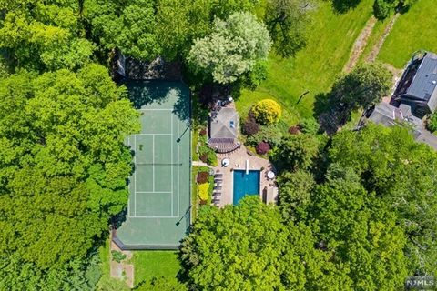 Rare Find in Prestigious Alpine! Two Fabulous Private Acres Of Gorgeous Landscaped Property With Huge Circular Driveway For 8+ Cars, Ig Heated Gunite Pool With Spa and Cabana, Newly Resurfaced Fully Lit Tennis & Pickleball Court, Handball/Basketball ...