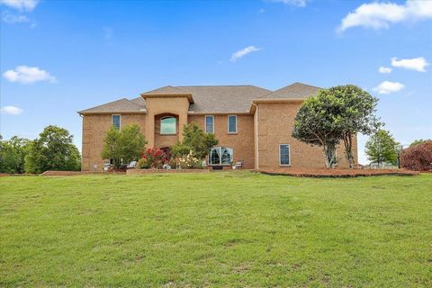 A welcoming elegance awaits you in over 5,900 sq/ft poised on over 11 lovely acres with a pond view.As you arrive on the circular drive , you are greeted by gorgeous landscaping which includes a rose garden and two inviting patios.Make your grande fo...