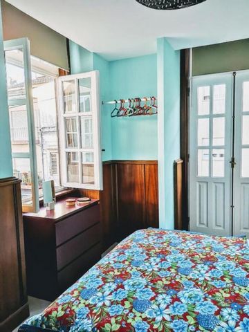 The Bedroom has a balcony, a private bathroom( at the corridor in front of the room), hanging clothing space and a dresser. A king size bed, workplace and heating is also available. Welcome to the historical center of Braga! The Chaplain house has be...