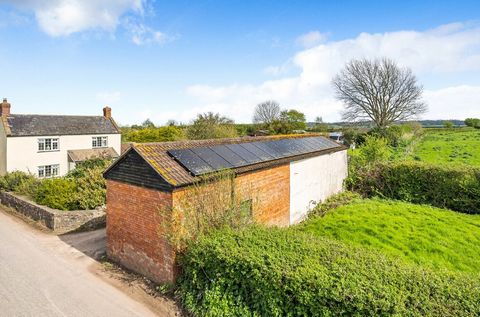 This charming detached cottage, sits within 0.7 acres of delightful gardens and separate paddock. Surrounded by fields on three sides, and featuring a collection of versatile outbuildings, including a detached barn with a history of planning permissi...