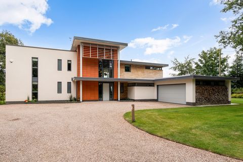 This exquisite 5 bedroom contemporary home sits on an elevated plot of just over 1 acre, offering awe-inspiring, far-reaching vistas that extend over the River Avon and stretch towards the picturesque New Forest. This exquisite contemporary residence...