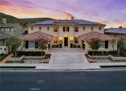 Graceful and elegant design combined with a resort like setting best describes this Tuscan Villa inspired estate, a shining gem located in desirable gated Whispering Hills with a heavenly location perched on a prime lot with unobstructed panoramic ba...