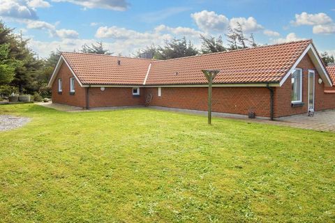 This holiday cottage is located on a large natural plot in quiet area. The plot is surrounded by trees and shrubs and is located in an attractive area approx. 200 m from the stunning North Sea beach. The structural division is functional and practica...