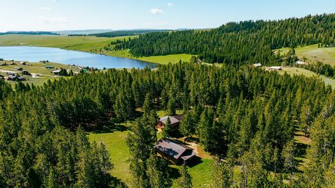 Log cabin on 45.5 acres in the Big Horn Mountains. 2BR/1BA with a loft or third bedroom nestled along the edge of the pine trees. Private well and septic with a 34 x 24 garage to store all your mountain toys. Also has outdoor pizza oven. Enjoy the wi...