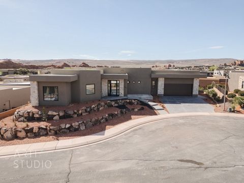 Live in peace and adventure in The Dunes at Sand Hollow. This stunning 4 bed, 5 bath has high-end finishes, is located in a premier golf community with breathtaking views, and has quick access to thrilling ATV rides in the nearby sand dunes. Some HOA...
