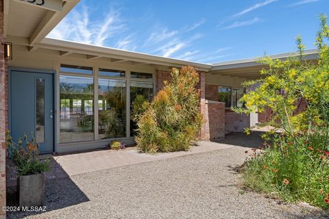 Nestled on a palm tree lined street in Historic Catalina Vista, midcentury modern style and a calm backyard oasis await you. Just a short stroll from Tahoe Park, the Arizona Inn, and the University of Arizona, this sprawling brick ranch is teeming wi...