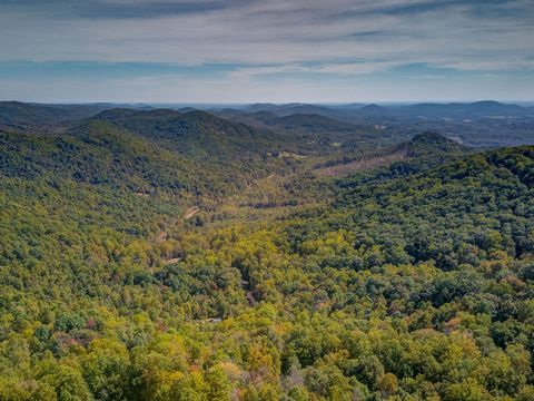 This private parcel of two lots (Pores Knob and Taylor Drive) offers the opportunity to build a spec or custom hideaway in the beautiful rolling foothills of the NC mountains. Located only 70 miles from Charlotte this location is ideal for an accessi...