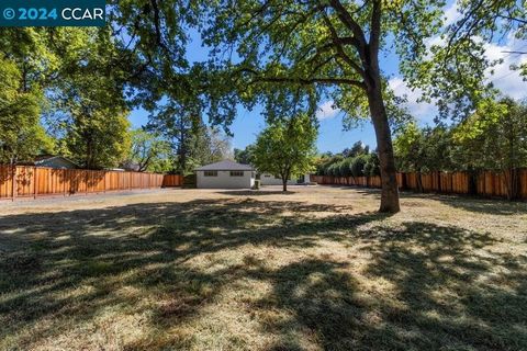 Incredible opportunity near downtown Walnut Creek! Single story family home with detached garage and workshop on close to an acre! Two lots with too many possibilities to list! Home boasts a lovely dining area with French doors opening to backyard pa...