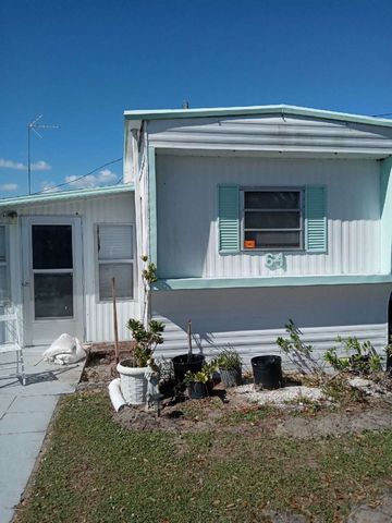 Inexpensive home in central Florida location. View of lake. Some furniture and appliances included. Great winter retreat. 55 plus, clubhouse, Non pets. Water/Sewer included. Enjoy clubhouse activities. Features: - Washing Machine - Furnished