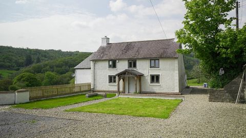 Dyffryn Cottage is an attractive character cottage situated in a magnificent Valley setting in the Carmarthenshire countryside. This five bedroom detached property offers singular and characterful accommodation including three good sized reception ro...