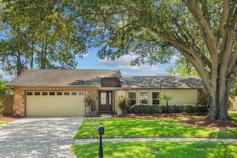 GORGEOUS 4 bed 2 bath home with large covered screened patio/pool! No more high electric bill, home has solar! Interior features include a beautiful kitchen open to family room and covered patio, cherry cabinets, solid granite counter tops, granite i...