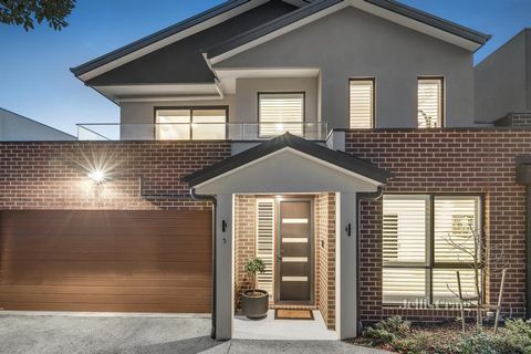 AUCTION THIS SATURDAY | Secluded within a leafy enclave of impeccable contemporary residences, this immaculate townhouse boasts a ground floor master suite, living areas on both levels, and an impressively spacious garden ideal for family play or out...
