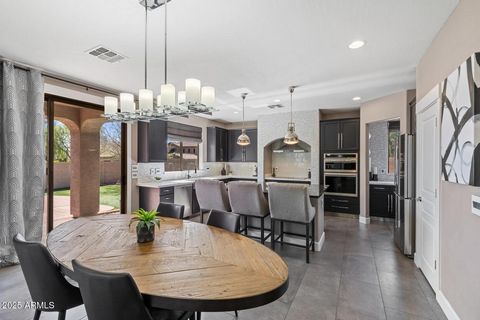 Stunning Updated Home in the Gated Desert Crown at Sonoran Foothills Community. This beautifully updated home is filled with on-trend features and offers a spacious, functional layout. The chef's eat-in kitchen boasts quartz and granite countertops, ...