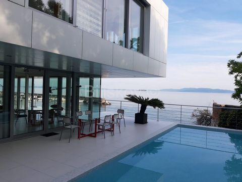 Rijeka - first row to the sea Luxury villa in the first row to the sea with an area of 600m2 built on a plot of 645m2. The villa consists of a ground floor and two floors. On the ground floor there is a work area with prepared installations for the k...