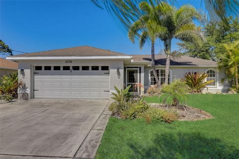 NEW ROOF going on this month! This contemporary and upgraded residence features a saltwater, heated pool, situated in a highly sought-after neighborhood in North Port. Conveniently located just minutes away from the Rays and Braves spring training st...