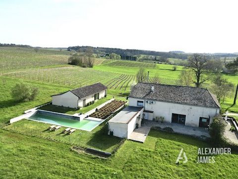 Near Duras, this magnificent renovated barn, nestled at the end of a private drive, perfectly merges the charm of stone and modern comfort. A large, open, bright space where every detail, from the wooden beams on the ceiling to the stone walls, has b...