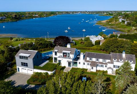 Absolute perfection at this stunning in-town compound featuring commanding water views over Oyster Pond! The result of a multi-year collaboration by top architects, designers and builders, this sophisticated and turn-key coastal offering seamlessly b...