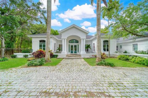 Beautiful 1-Story Executive home in the heart of North Pinecrest! This home features 7 Bedrooms 7.5 Bathrooms, with High Vaulted 15ft ceilings, Media play room, over 6,680 Sqft on a 1 Acre Lot, Chefs Kitchen, Outdoor BBQ and cabana, Basketball court....