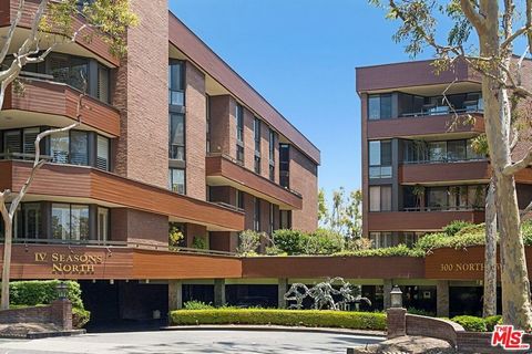 Gorgeous sunlight bathes this condominium situated in the highly sought-after IV Seasons building of Beverly Hills. As you enter through the formal foyer, you'll discover an expansive open floor plan encompassing an enormous living room with a firepl...