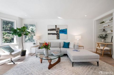 Cole Valley living awaits in this impeccably appointed light-filled top-floor Condo, located in a 2-unit Art Deco building on one of the most charming streets in the neighborhood. Enter your spacious sanctuary among the trees with views of the surrou...