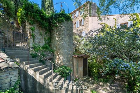 Positioned on the side of a cliff, this restored 289m2 farmhouse is located on 2000m2 of wooded land in the heart of the village of Cornillon Confoux. The character of this vernacular building is found in the old materials, stone, terracotta and wood...