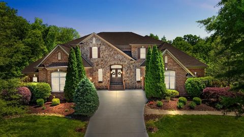Expansive 8,000+ sqft luxury estate on serene corner lot offers unparalleled sophistication and style. Striking curb appeal, lush landscaping and resort-style backyard welcome you. Dramatic double stairway foyer entry, heavy moldings and statement wi...