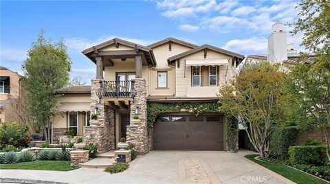 Welcome to 5 Wyeth, nestled within the esteemed community of Oak Knoll Village, in a coveted cul-de-sac location. This residence boasts a spacious design, highlighted by a family room warmed by a fireplace and enhanced with a built-in entertainment c...