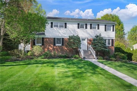 Enjoy a perfect combination of house and property in this beautiful offering at 6 Paradise Drive in the Edgemont School District. This lovely and very bright Center Hall Colonial sits on .27 acres of level, usable, private and lush land, that is extr...